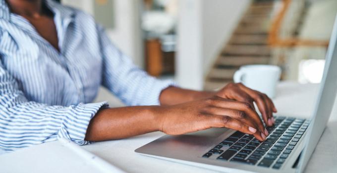 person typing on computer