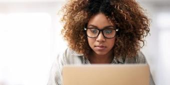 woman looking at laptop
