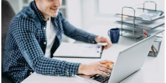 person typing on a laptop